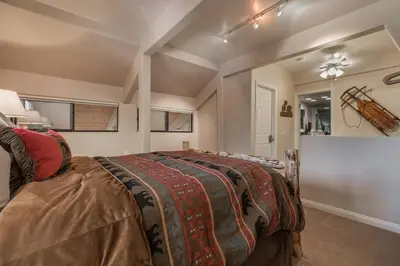 a bedroom with a large bed in a room at Mammoth Basecamp Condo with Views near Village with AC and Fireplace in Mammoth Lakes