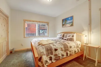 a bedroom with a bed and a window at TaHaus Hot Tub Pool Table Dog Friendly in South Lake Tahoe