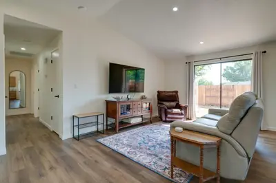 a living room with a couch and a table at Quiet Home with Yard 2 Mi to Mall and Sparks Marina! in Sparks