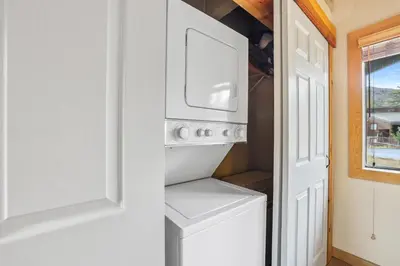 a white washer and dryer in a white kitchen at Comfort in the Sierras - Edelweiss 2BR - Kirkwood condo in Markleeville