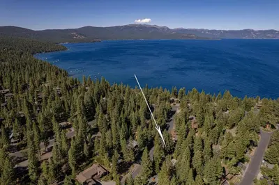 an aerial view of a lake with trees and houses at Twin Hollow at Dollar Point by Tahoe Getaways - 5BR w Game Room & Hot Tub in Tahoe City
