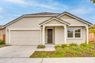 a house with a garage at Newly Built Home with Patio 4 Mi to Dtwn Hollister in Hollister