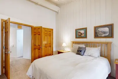 a bedroom with a large white bed in a room at Sierra Park Villas 84 R in Mammoth Lakes