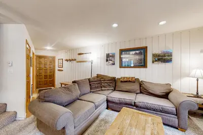 a living room with a couch and a table at Sierra Park Villas 84 R in Mammoth Lakes