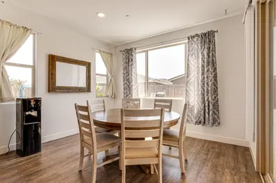 a dining room with a table and chairs at 1 Mi to Golf! Spacious and Modern Home in Dinuba in Dinuba