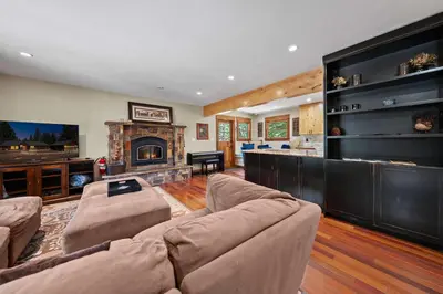 a living room with a couch and a fireplace at Cozy Aspen Haven - Stay for 6 in Truckee