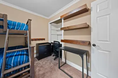 a room with bunk beds and a desk and a computer at Cozy Aspen Haven - Stay for 6 in Truckee