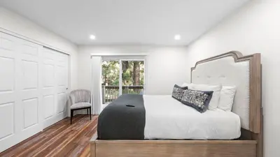 a bedroom with a bed and a chair and a window at Cozy Forest Hideaway in Incline Village Private Balcony Sierra Solace by AvantStay in Incline Village