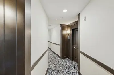 a hallway with doors and a tile floor and a corridor at Ski-InandSki-Out Condo with Views in Olympic Valley in Olympic Valley