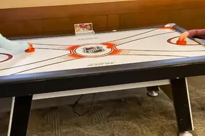 a ping pong table being prepared for a game at Ski-InandSki-Out Condo with Views in Olympic Valley in Olympic Valley