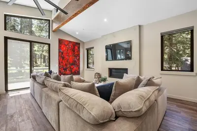 a large living room with a large couch at Song of the Sierras - 4 Bed, 4 Bath Luxury Tahoe Home in South Lake Tahoe