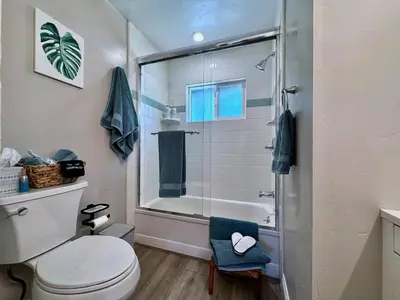 a bathroom with a toilet and a glass shower at Peaceful Country Getaway Near Casino Shopping in Placerville