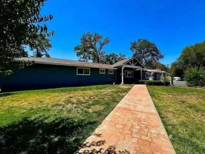 a house with a brick driveway in front of it at Peaceful Country Getaway Near Casino Shopping in Placerville