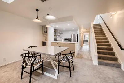 a kitchen and dining room with a table and chairs at River Run # 15 by Tahoe Getaways - 2 BR w Private Balcony, River Views & Shuttle in Alpine Meadows