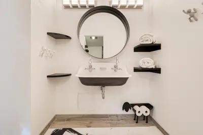 a bathroom with a sink and a mirror at River Run # 15 by Tahoe Getaways - 2 BR w Private Balcony, River Views & Shuttle in Alpine Meadows
