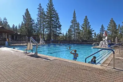 a group of people in a swimming pool at Hearthlight Cabin at Tahoe Donner by Tahoe Getaways - Pet-Friendly 3BR w Guest Suite in Truckee