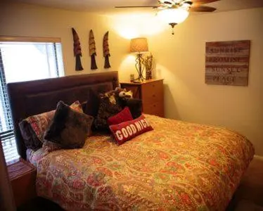 a bedroom with a bed with pillows on it at Amazing Gem Next to golf course with View- Pool & jacuzzi in Mammoth Lakes