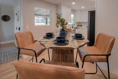 a kitchen and dining room with a table and chairs at Folsom Old Town Escape • Cozy Cottage + Library in Folsom