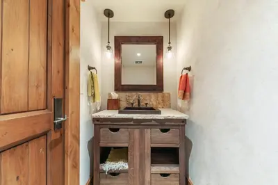a bathroom with a sink and a mirror at Beyond the Blue Lakefront Escape by Tahoe Getaways - Pet-Friendly 6BR with Pier, Buoy & Hot Tub in Carnelian Bay