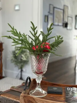 a vase with a christmas tree in it on a table at Historic 1914 Cottage, Near Downtown, UNR & Hospitals, Early Check In in Reno
