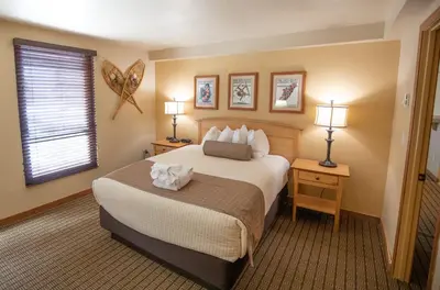 a hotel room with a bed and two lamps at Kingsbury of Tahoe in Stateline