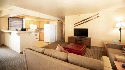 a living room with a couch and a kitchen at Kingsbury of Tahoe in Stateline
