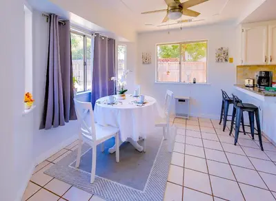 a kitchen and dining room with a table and chairs at Cozy Room#1 Best Moscato in Clovis