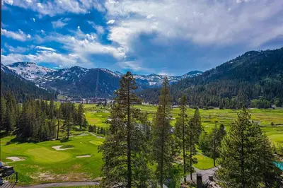an aerial view of a golf course in the mountains at Olympic Valley Studio Condo with Resort Pools, Spa in Olympic Valley