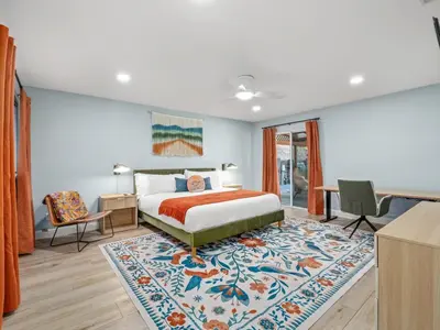 a bedroom with a bed and a rug at Serene Views with Hot Tub, BBQ, Fire Pit, Game Room in Oakhurst