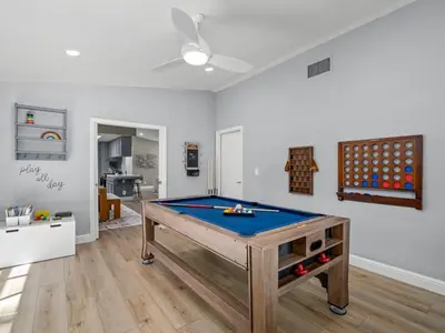 a living room with a pool table in it at Serene Views with Hot Tub, BBQ, Fire Pit, Game Room in Oakhurst
