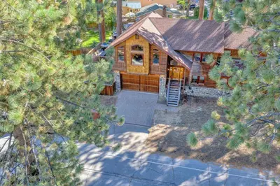 an overhead view of a wooden house with a porch at Tahoe Island Retreat Hot Tub & Game Room in South Lake Tahoe