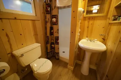 a bathroom with a toilet and a sink at Tamarack Lodge Motel in Tahoe City