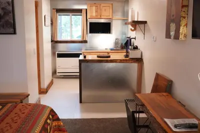 a small kitchen with a counter and a stove at Tamarack Lodge Motel in Tahoe City