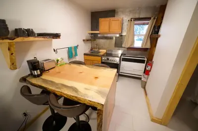 a kitchen with a wooden counter top in a room at Tamarack Lodge Motel in Tahoe City