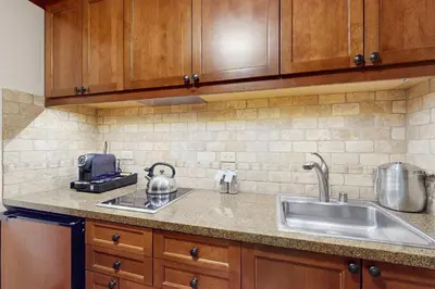 a kitchen with a sink and a counter top at Community Perks! Everline Resort and Spa Retreat in Olympic Valley