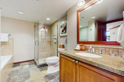a bathroom with a sink and a toilet and a shower at Community Perks! Everline Resort and Spa Retreat in Olympic Valley