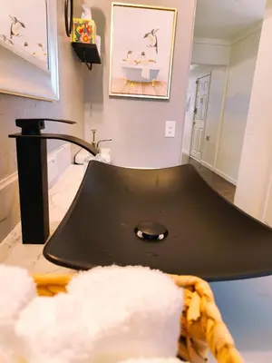 a bathroom with a black sink in a room at Old Fig House - Historic Fig Garden Neighborhood in Fresno