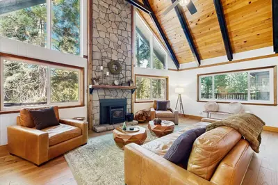 a living room with a couch and a fireplace at Hot Tub, Game Room and Home Gym Serene Arnold Gem in Arnold
