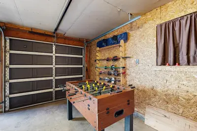 a game room with a foosball table and wine racks at Hot Tub, Game Room and Home Gym Serene Arnold Gem in Arnold