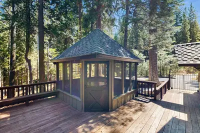 a small gazebo on a wooden deck at Hot Tub, Game Room and Home Gym Serene Arnold Gem in Arnold