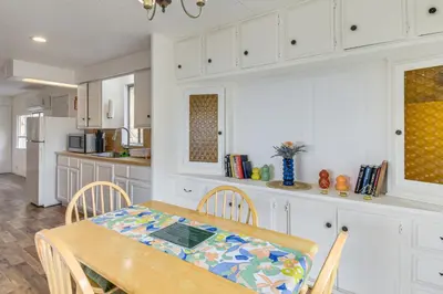 a kitchen with a table and chairs in a kitchen at Mtn-View Coulter Escape with Rustic Tree Lookout in Coulterville