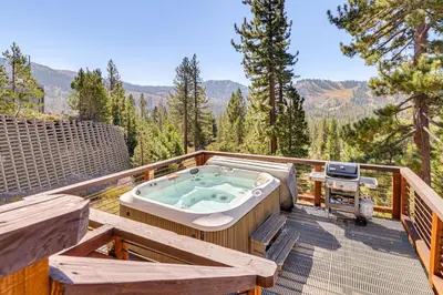 a hot tub on a deck with a view at Endless Mtn Views! Group Ski Lodge at Sugar Bowl in Norden