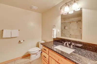 a bathroom with a sink and a toilet at Endless Mtn Views! Group Ski Lodge at Sugar Bowl in Norden