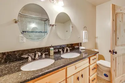 a bathroom with two sinks and a mirror at Endless Mtn Views! Group Ski Lodge at Sugar Bowl in Norden