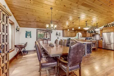 a kitchen and dining room with a wooden ceiling at Tahoe Timber Retreat in Carnelian Bay