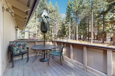 a balcony with a table and chairs and a window at Sierra Snow Haven in Incline Village