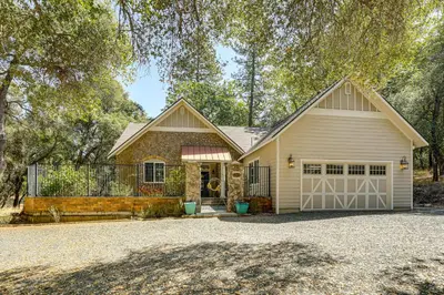 a house with a garage with a driveway at All-Season Outdoor Base Camp Gold Country Home! in Fiddletown