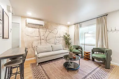 a living room with a couch and two chairs at Designer Living Pet-Friendly UNR 2BR 1BA in Reno
