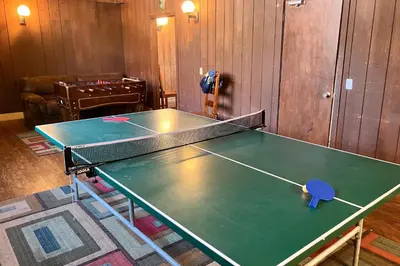 a ping pong table in a room with a ping pong ball at Fireside 106 in Mammoth Lakes
