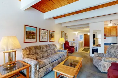 a living room with a couch and a table at Val D'Isere 30 in Mammoth Lakes